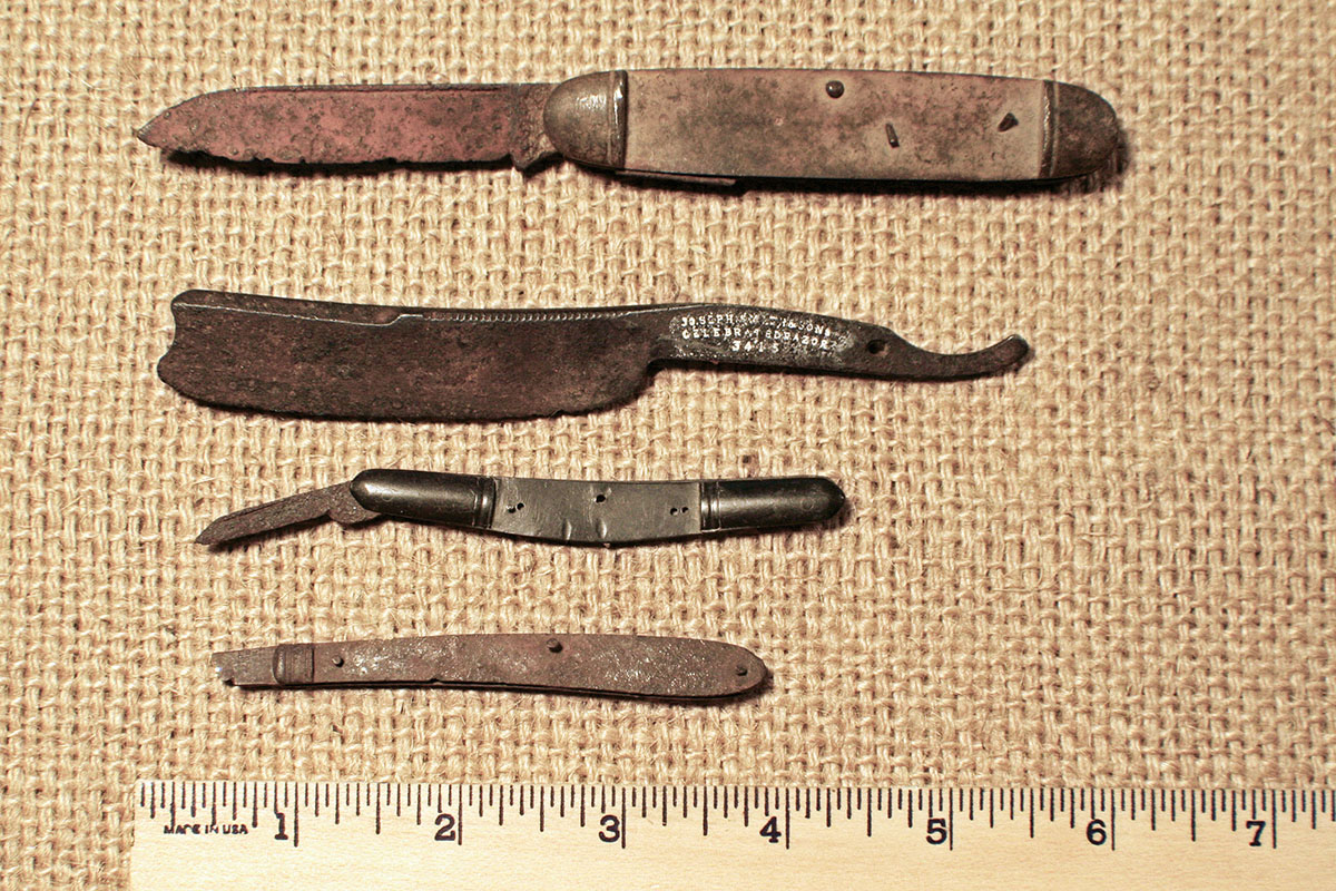 A typical pocket knife, two small pen knives and a straight razor, all found at the fort.